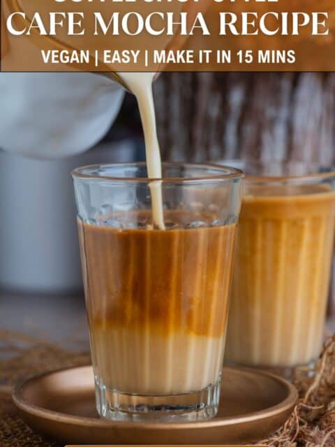 Vegan white chocolate café mocha latte with espresso shot and frothy oat milk and text at the top and bottom.