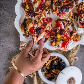 Healthy frozen cottage cheese bark broken into bite-sized pieces, perfect for festive snacking.