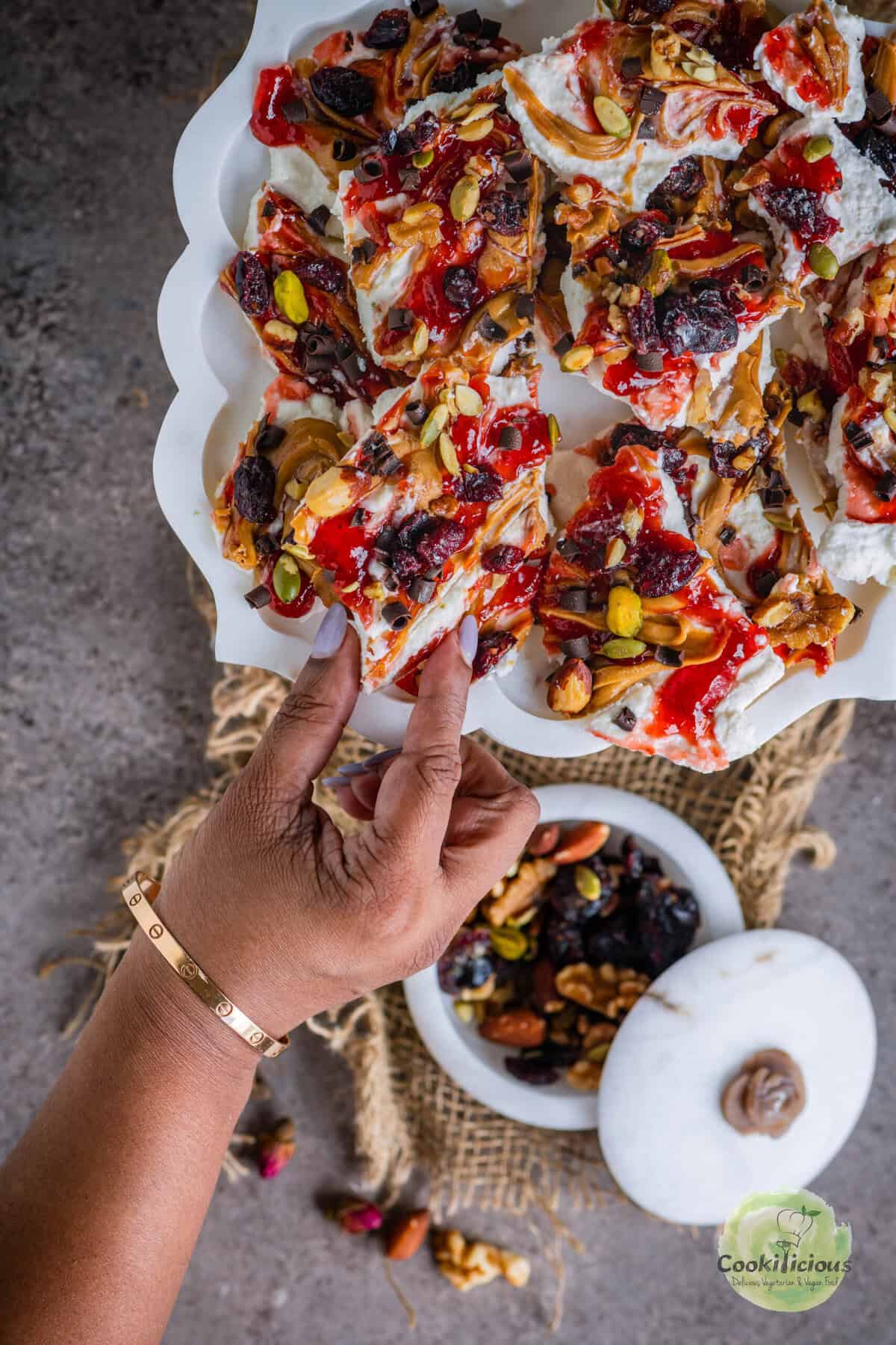 Healthy frozen cottage cheese bark broken into bite-sized pieces, perfect for festive snacking.