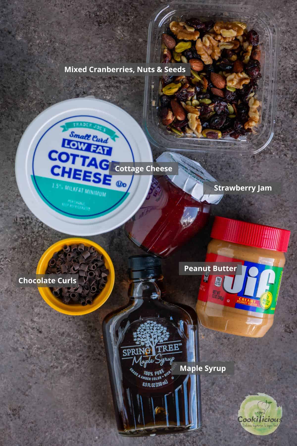 all the ingredients needed to make cottage cheese bark placed on a table with labels on them.