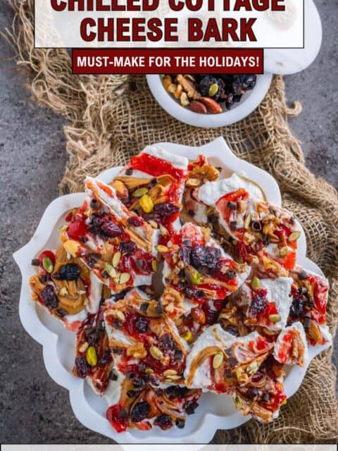 Healthy frozen cottage cheese bark recipe topped with strawberry jam and peanut butter swirls and text at the top and bottom.