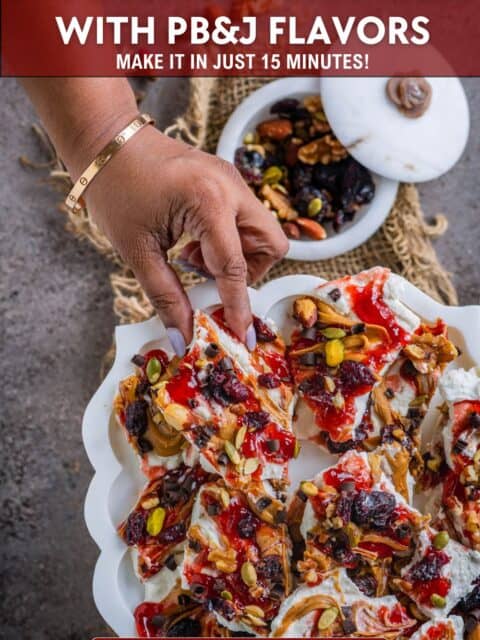 Holiday-ready no-bake cottage cheese bark with PB&J flavors, served in marble tray. and text at the top and bottom.