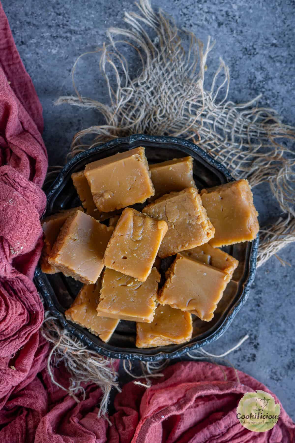 Soft and fudgy Mysore Pak pieces on a plate.