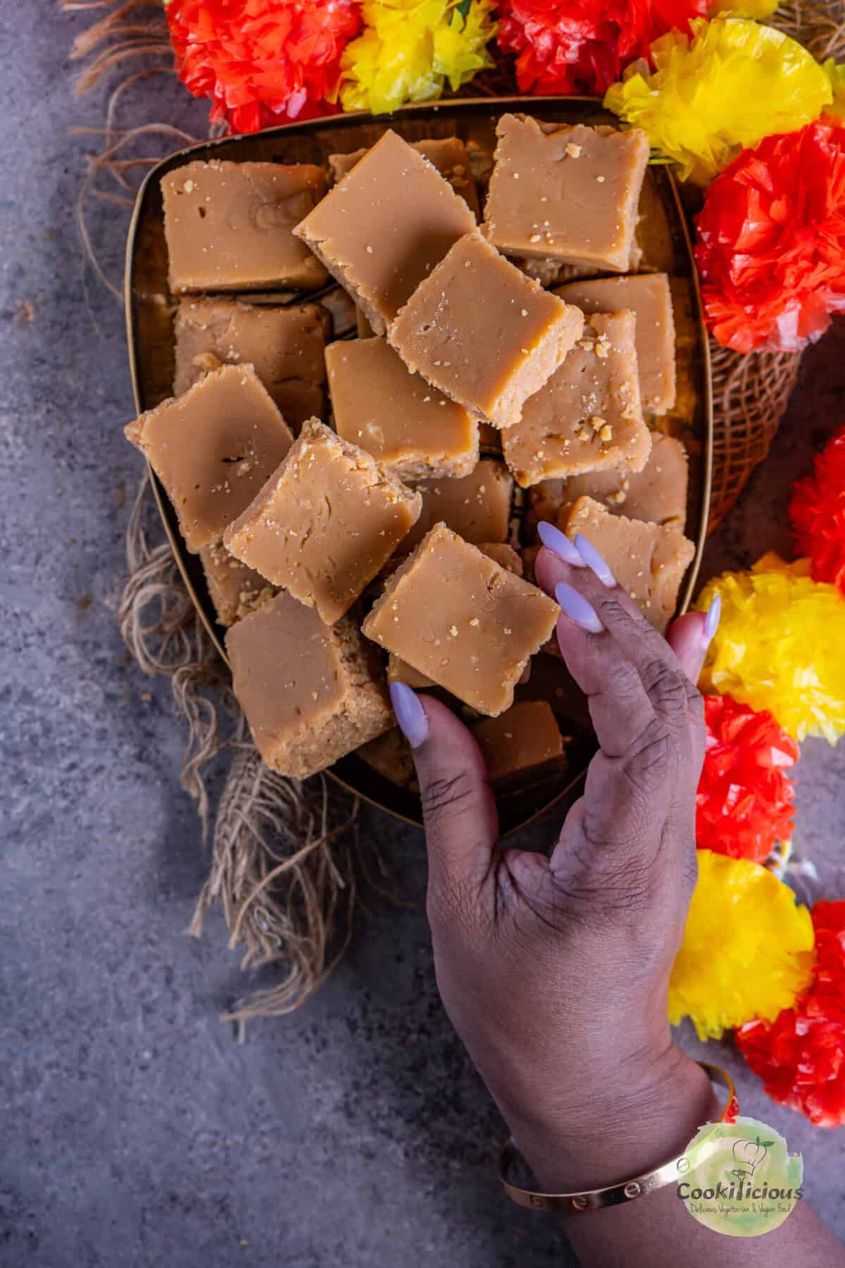Biscoff Mysore Pak served on a festive plate, ideal for Diwali gifting.