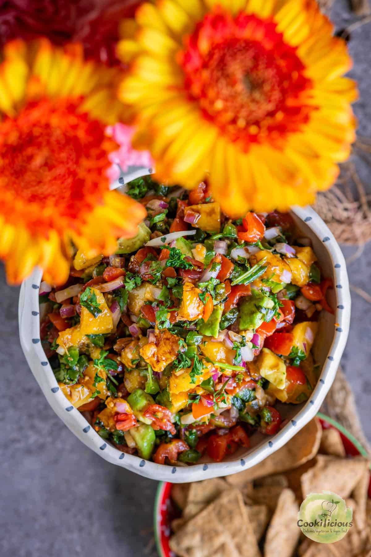 Homemade fruit salsa with fresh herbs, jalapeño, and a drizzle of citrus dressing.