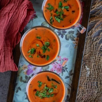 Tomato Saar served in shot glasses - savory Indian tomato drink made with coconut milk and spices.
