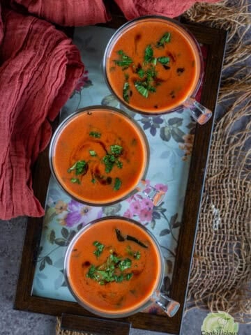 Tomato Saar served in shot glasses – savory Indian tomato drink made with coconut milk and spices.
