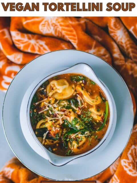 Vegan Instant Pot Tortellini Soup served in a white bowl and text at the top and bottom.