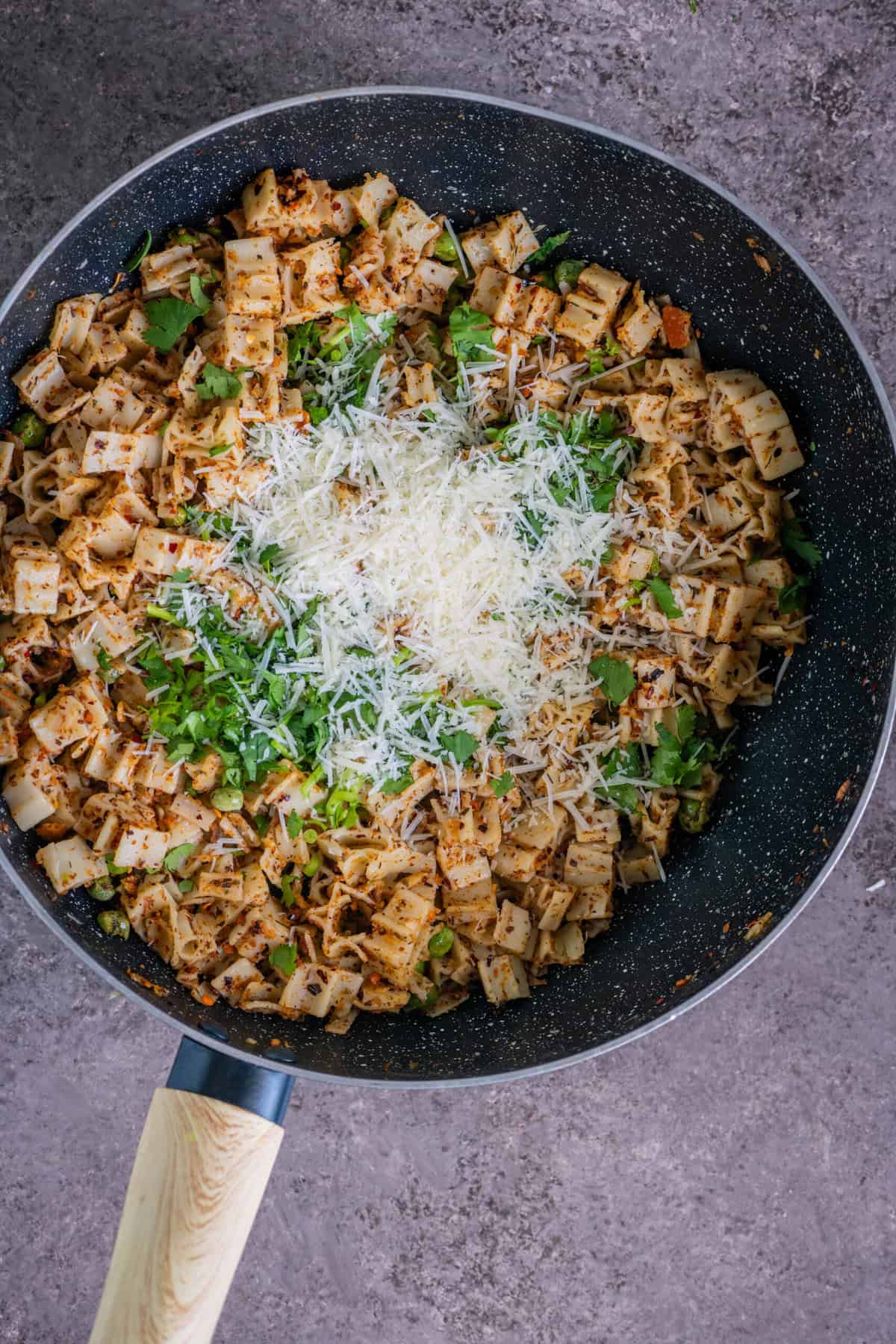 Vegan pasta with breadcrumbs garnished with dairy-free Parmesan.