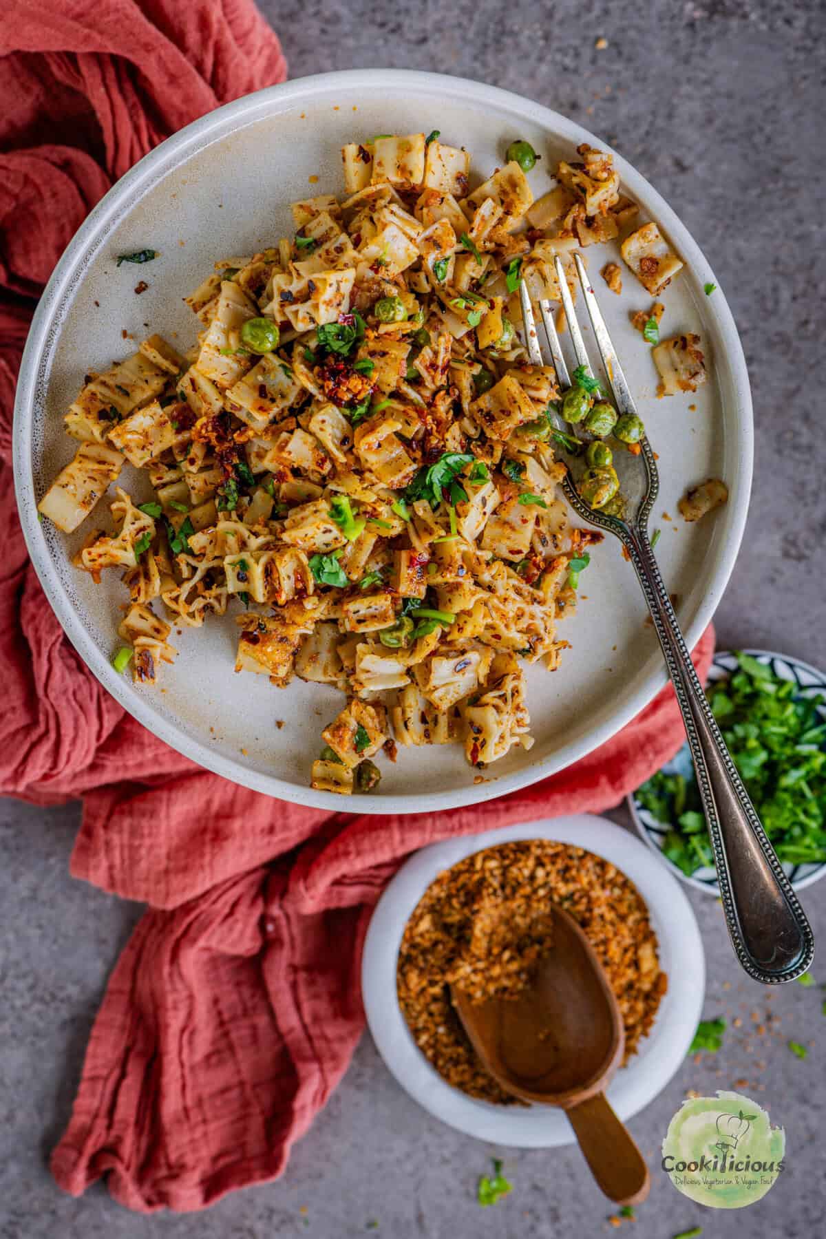 Close-up of vegan pasta with toasted breadcrumbs and olive oil.