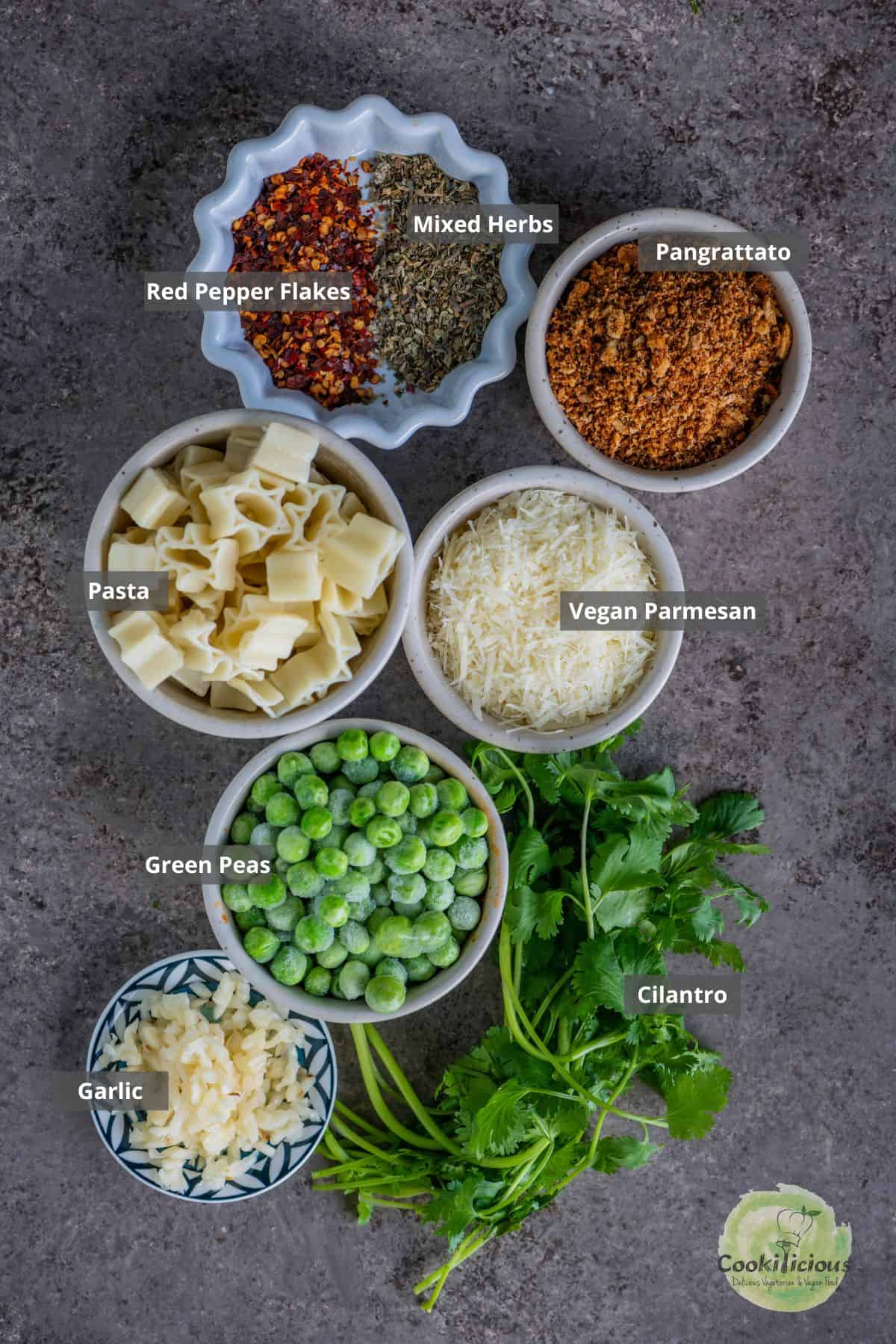 all the ingredients needed to make vegan pasta with breadcrumbs with labels on them.