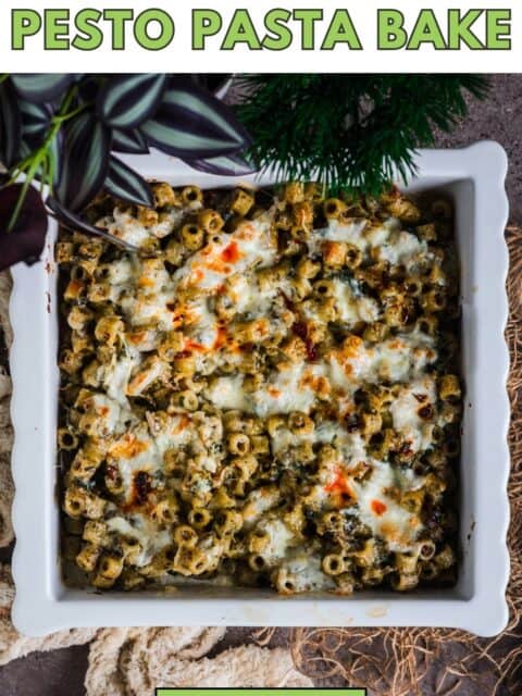 Golden, bubbly pesto pasta bake fresh out of the oven with melted mozzarella and burrata and text at the top and bottom.