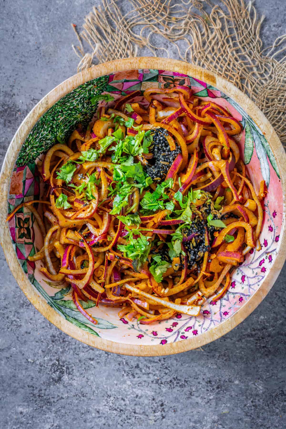 Finished onion salad mixed with lemon juice or vinegar and garnished with fresh cilantro.