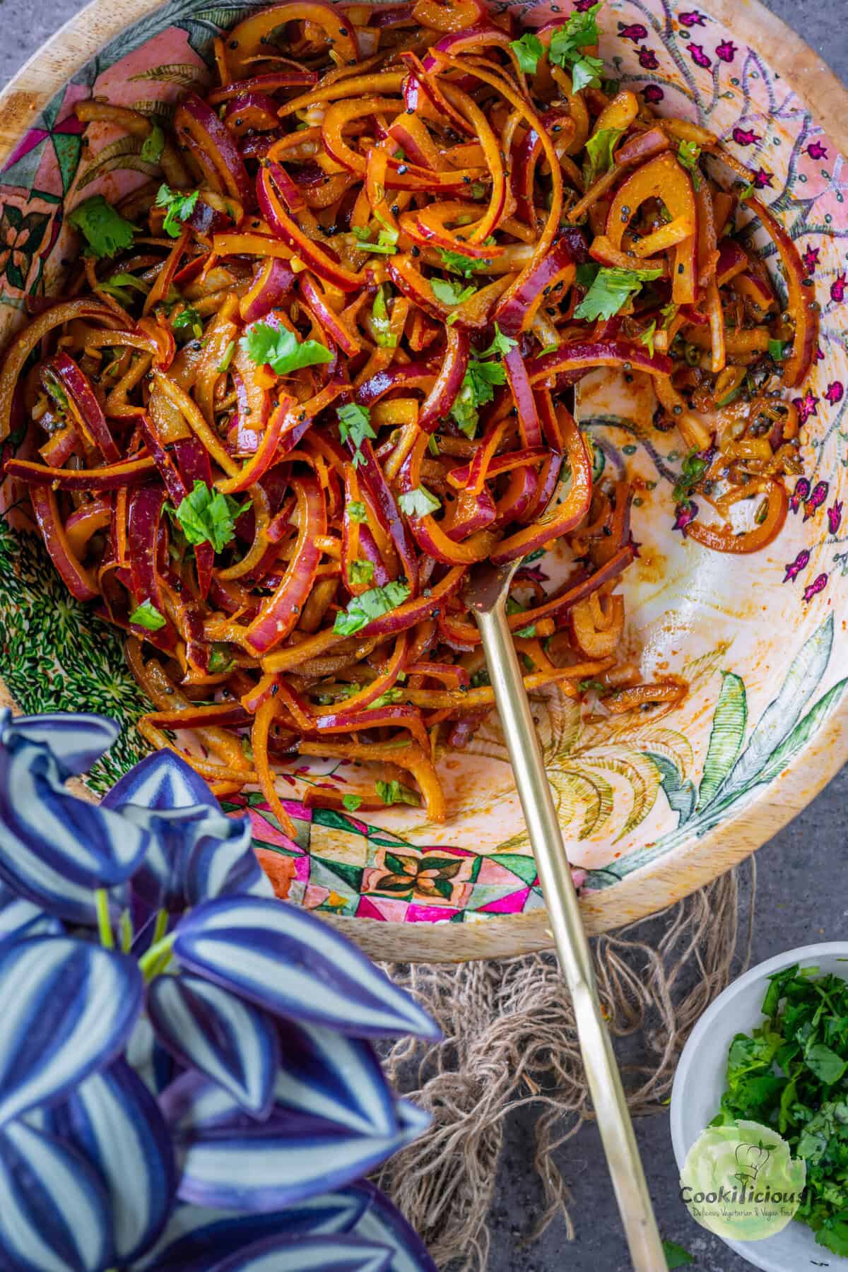 Fresh and crunchy onion salad with Indian spices served in a salad bowl.