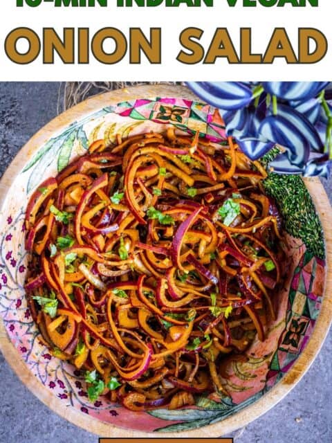 Spicy red onion salad with tempering and lemon juice, served in a bowl and text at the top and bottom.