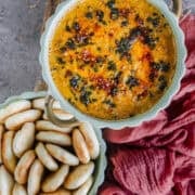 Creamy Paneer Pav Bhaji Dip served in a bowl with mini naan for dipping.