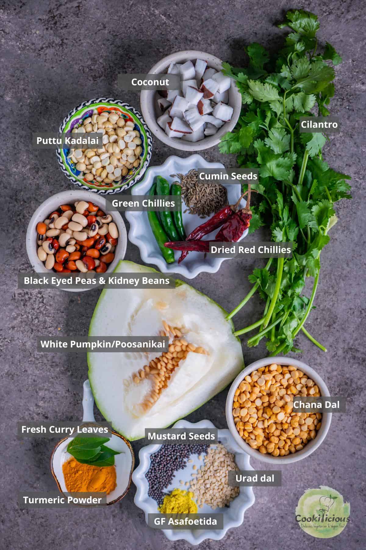 all the ingredients needed to make poosanikai poricha kootu placed on a table with labels on them.
