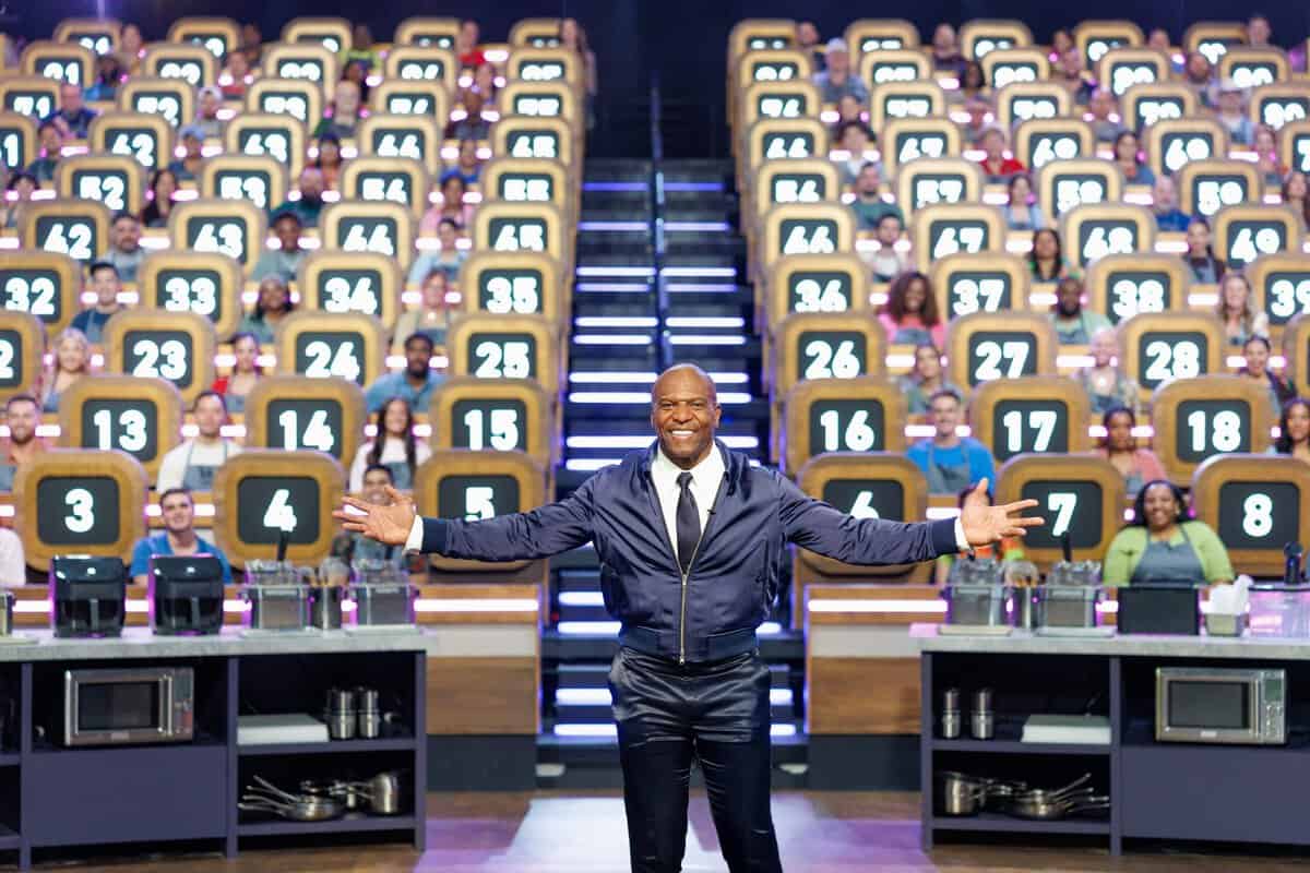 Terry standing in front of all the 100 Cooks.