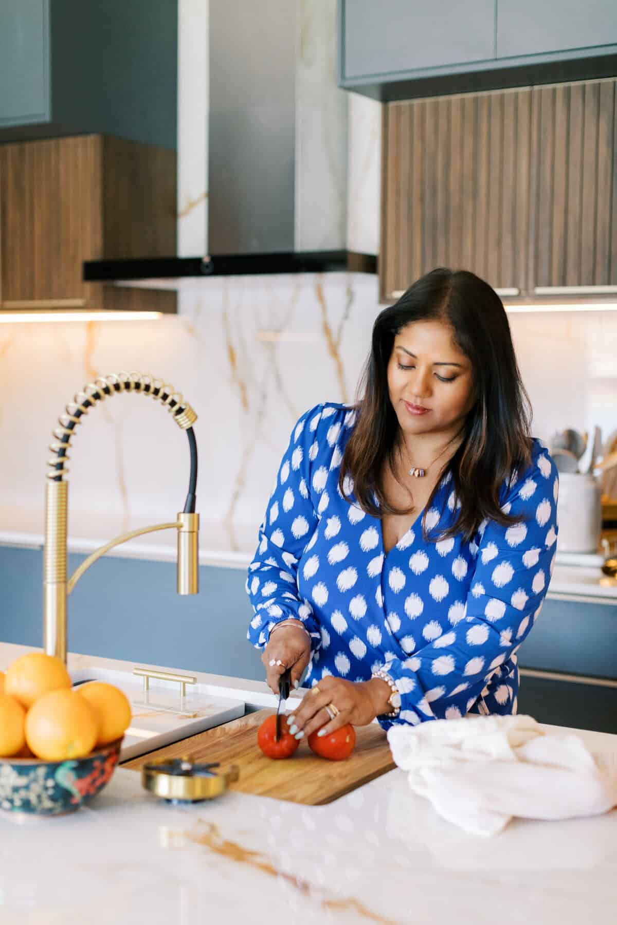 Priya cooking in her kitchen