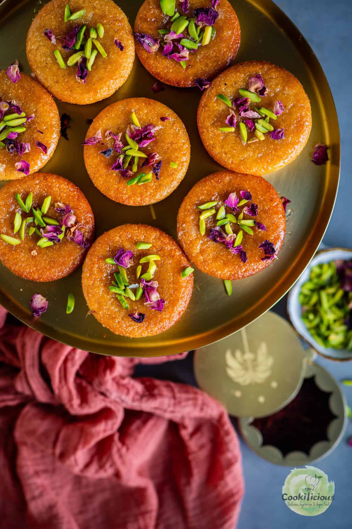 Eggless Gulab Jamun flavored soft rava cakes soaked in sugar syrup.